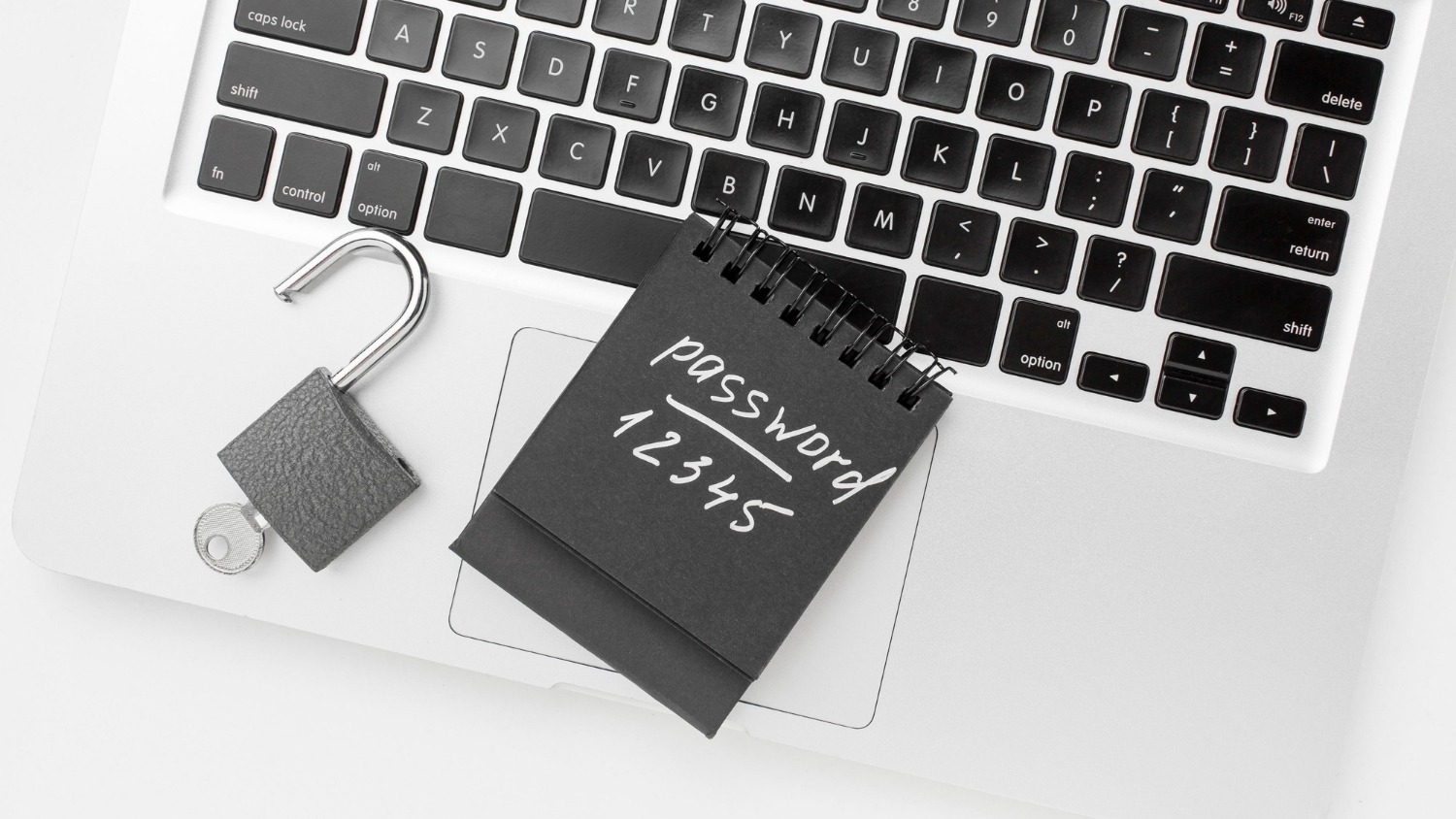 flat-lay-of-laptop-with-lock-and-key
